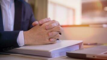 Hands of a thoughtful, hr recruiter making hiring decision at difficult job interview, opponents dialogue debate, business confrontation challenge concept, pray hope and negotiation business dealing photo