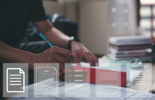 businessman writing on paper with virtual document in Document data system Report HR technology Concept, data analysis, research and development photo