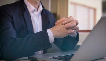 Hands of a thoughtful, hr recruiter making hiring decision at difficult job interview, opponents dialogue debate, business confrontation challenge concept, pray hope and negotiation business dealing photo