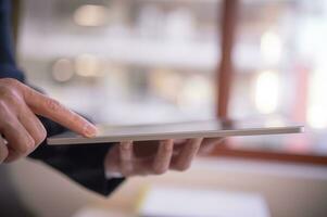 business and technology concept, social media working and life styles, businessman using digital tablet searching surfing on internet network, data analysis business online report photo