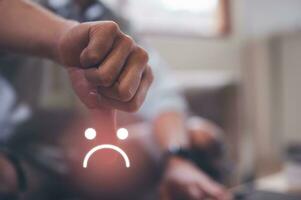 Customer Experience dissatisfied Concept, Unhappy Businessman Client with Sadness Emotion Face on smartphone screen, Bad review, bad service dislike bad quality, low rating, social media not good. photo