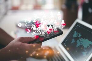 man hand using a smartphone to play social media, a mobile phone with a notification icon and working on laptop computer, Social Distancing ,Working From Home concept photo