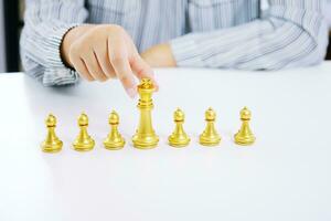 Human resources concept career management with clasped hands planning strategy with chess figures. photo