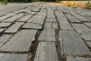 Stone paving stones. Background of stones. An old road laid out of treated stones. stone pavement in perspective photo