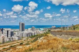 View of the Naot Peres district of Haifa, the stadium and the sea coast photo