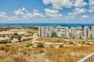 View of the Naot Peres district of Haifa, the stadium and the sea coast photo