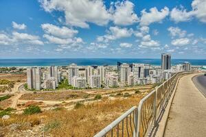 View of the Naot Peres district of Haifa, the stadium and the sea coast photo