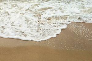 Sea Wave on the Sand Beach Close Up Background photo