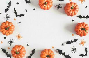 Happy Halloween banner or party invitation background with clouds bats and pumpkins photos