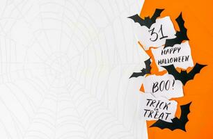 Happy Halloween banner or party invitation background with clouds bats and pumpkins photos