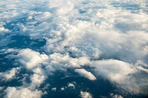 Aerial view of clouds in the sky on sunny day photo