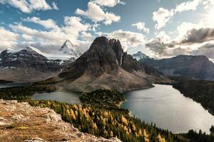 Mount Assiniboine with lake in autumn forest on Niblet peak at provincial park photo