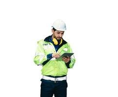 Caucasian technician engineer man in uniform with tablet checking the system photo