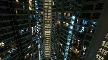 Window lights in multistorey house at night, Kuala Lumpur photo
