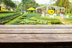 Wood table top on plantation garden photo