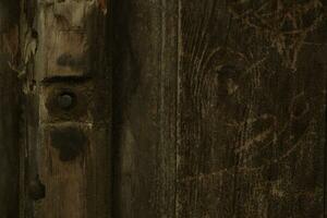 antecedentes textura de antiguo madera con un tornillo foto