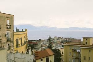 City houses and Gulf of Naples in Italy. photo
