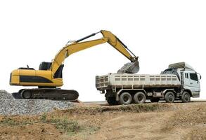 Backhoe heavy machine scoop rock to truck photo