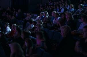 Audience applauding, during a spectacular event photo