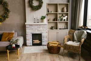 Modern fireplace decorated on Christmas Eve in the Scandinavian living room photo