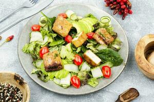 Salad with fresh vegetables and tofu. photo