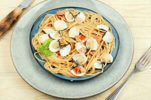 Pasta with fried clams. photo