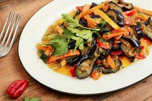 Aubergine saute, vegetable stew, caponata. photo