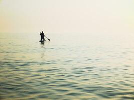 Old woman in the sea. photo