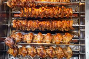 Rotisserie chicken on a rack photo