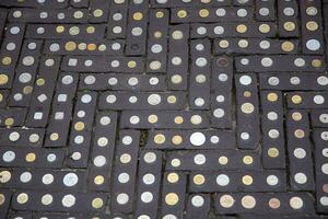 Coins on a walkway photo