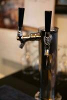 Beer tap at a brewery photo