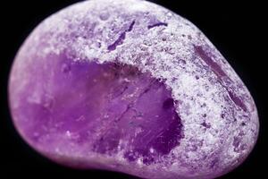 Macro mineral amethyst on a black background photo