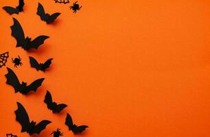 Happy Halloween banner or party invitation background with clouds bats and pumpkins photos