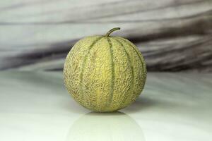 Orange  cantaloupe melon on the table. photo