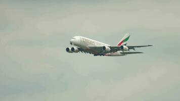 FRANKFURT AM MAIN, GERMANY JULY 20, 2017 - Emirates Airbus A380 flies in the sky for landing. Fraport, Frankfurt, Germany video