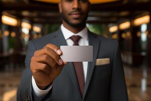Businessman Wearing Formal Suit Showing Business Card to Offer Cooperation with Client photo