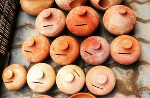 Clay pot banks,clay piggy banks,guluck,coins save clay pottery,top view a pile of clay pottery container photo