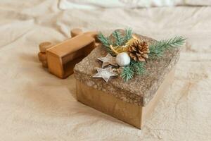 Brown craft box with a Christmas gift. Handmade gift. The concept of New Year and Christmas. photo