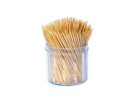 A toothpick in a large jar with a mouth opener that everyone likes to use after cooking. photo