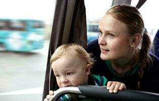 Mother and son travel by bus. photo