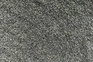 amapola semillas fondo, negro semillas textura foto