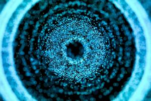 negro agujero con azul brillante partículas, 3d representación. foto