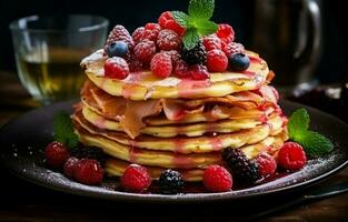 Stack of fresh fluffy pancakes decorated on top with forest berries rotating on a plate and pouring honey syrup. Delicious, healthy. Fresh bakery concept. photo