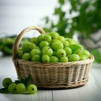 Green gooseberry in a basket on a white round wooden table, Beautiful white background. photo