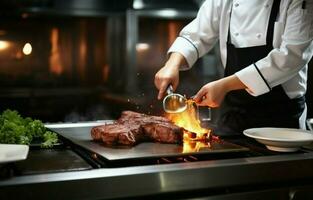 Inside a modern restaurant kitchen, a chef in a white uniform is carefully roasting and basting beef steak with oil in a barbecue oven. photo