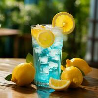 Enjoy a refreshing drink with ice cubes, lemon, and slices of fresh fruit in a light blue, icy, and transparent beverage. photo