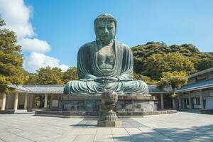 The great blue buddha statue Kamakura Daibutsu at Kotoku in shrine temple in Kamakura,Kanagawa, Japan photo