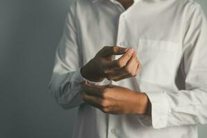 Closed up of businessman getting dressed isolate on white background. working concept. photo