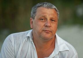 Outdoor portrait of mature man photo