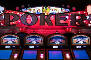 Casino gambling machines waiting for gamblers and tourist to spend money photo